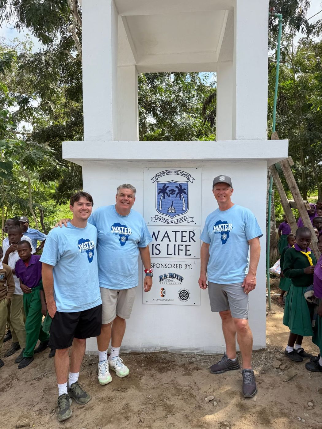 The new fresh water well, with a Water Is Life sign naming the Kristin Rose Foundation as a sponsor